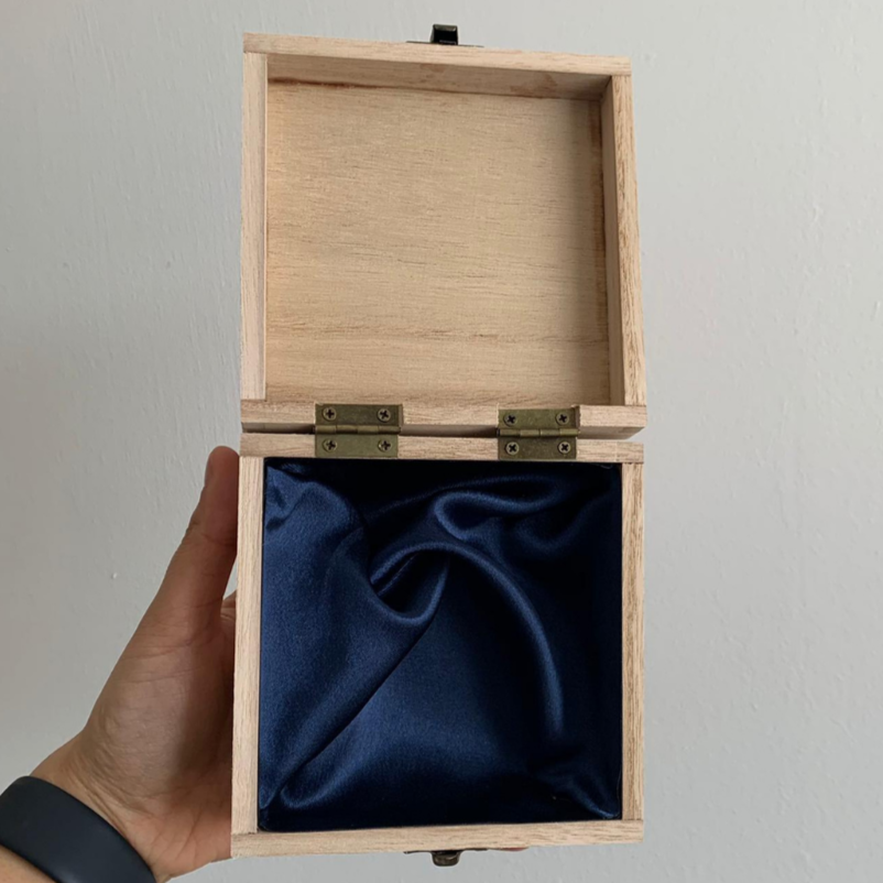 Wooden box open navy lining