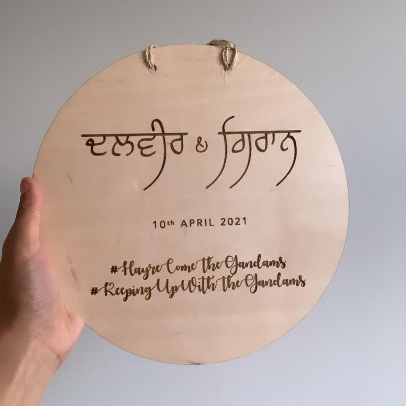 Personalised circular plaque with lady logo and non-turban man 