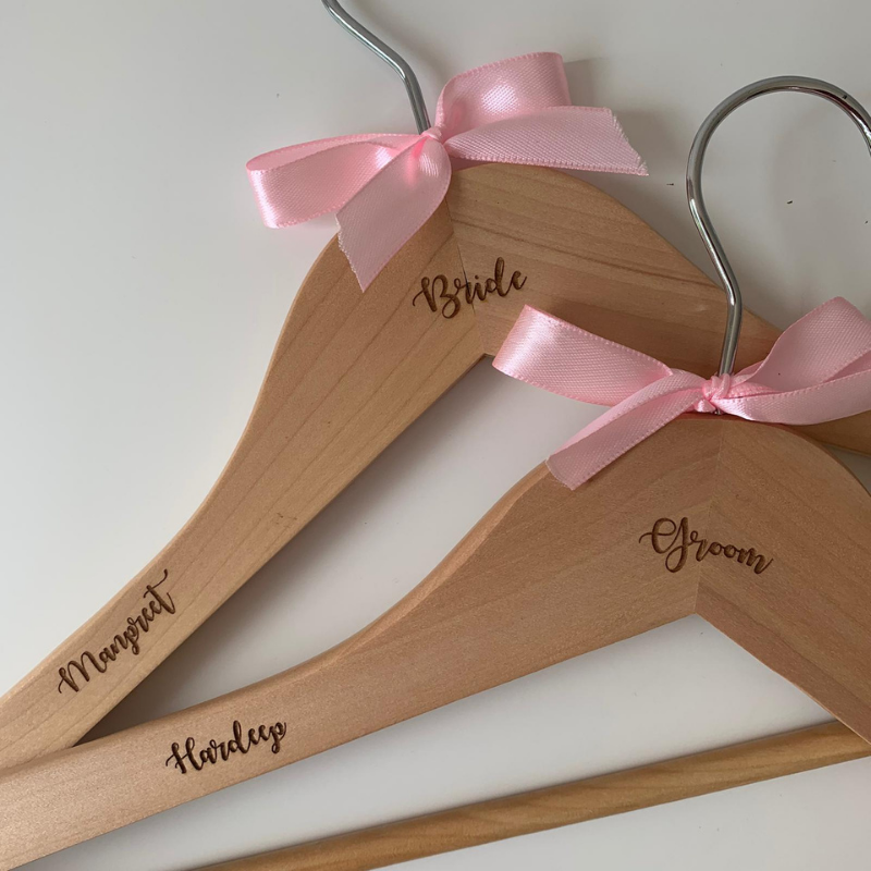 Personalised wooden hangers with pink bow