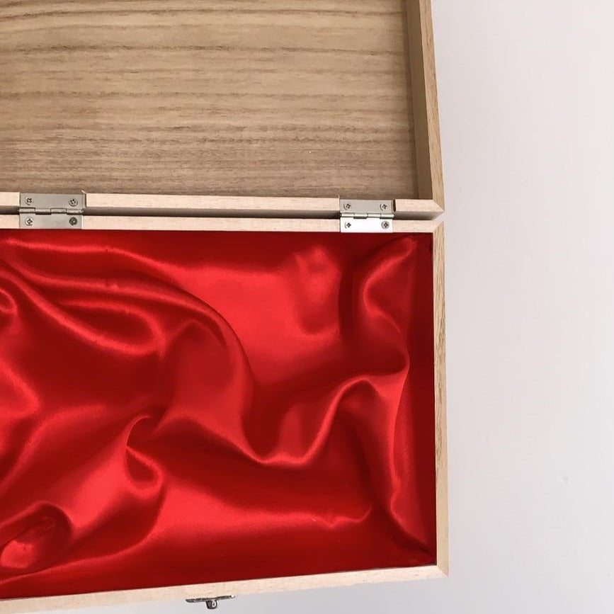 Wooden box open red lining